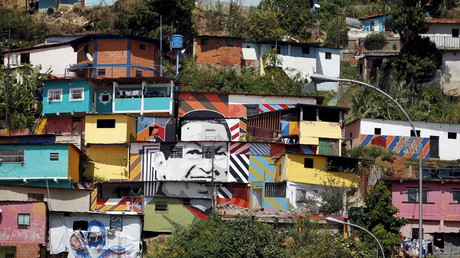 Bildnis von Venezuelas langjährigem Staatschef Hugo Chávez an Hauswänden in einem Armenviertel von Caracas, 6. December 2015